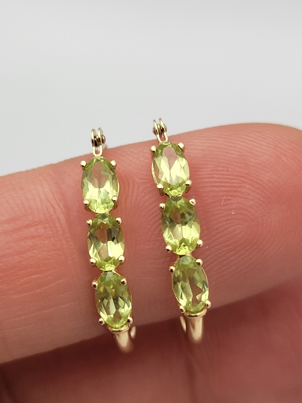 14K Gold Hoop Earrings with Peridot Green Oval Gemstones